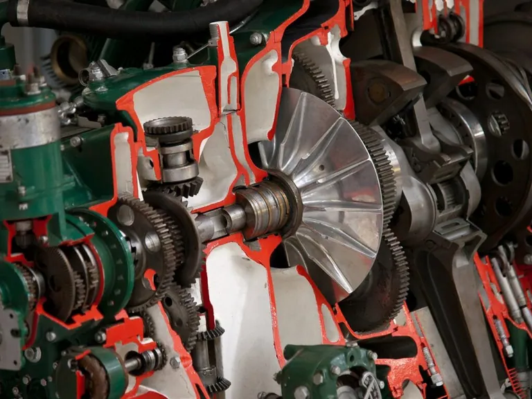 Close view of gears and metal components inside industrial machinery