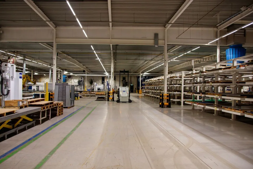 Industrial warehouse with machinery and storage shelves